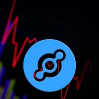 The helium coin logo in front of a price graph