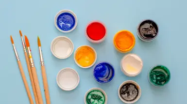 Small pots containing different paint colours Small pots containing different paint colours