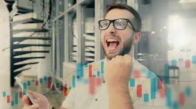 Excited day trader celebrates successful day on the stock market Excited day trader celebrates successful day on the stock market