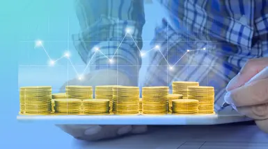 A person carries a tray with a bunch of glittering gold crypto tokens A person carries a tray with a bunch of glittering gold crypto tokens