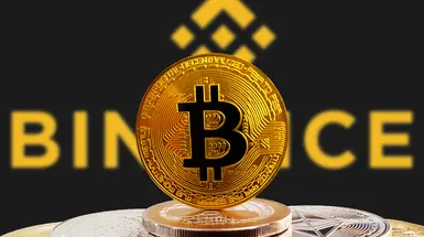 Bitcoin foregrounding Binance logo – Photo: Shutterstock