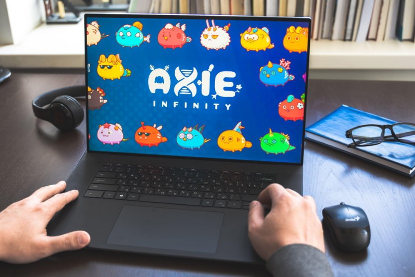 A laptop with the Axie Infinity logo